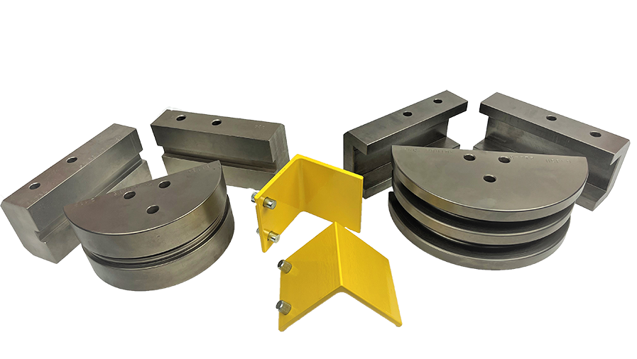 A photo shows two sets of Ben Pearson square bending dies and back shoes with two bright yellow brackets in the middle.