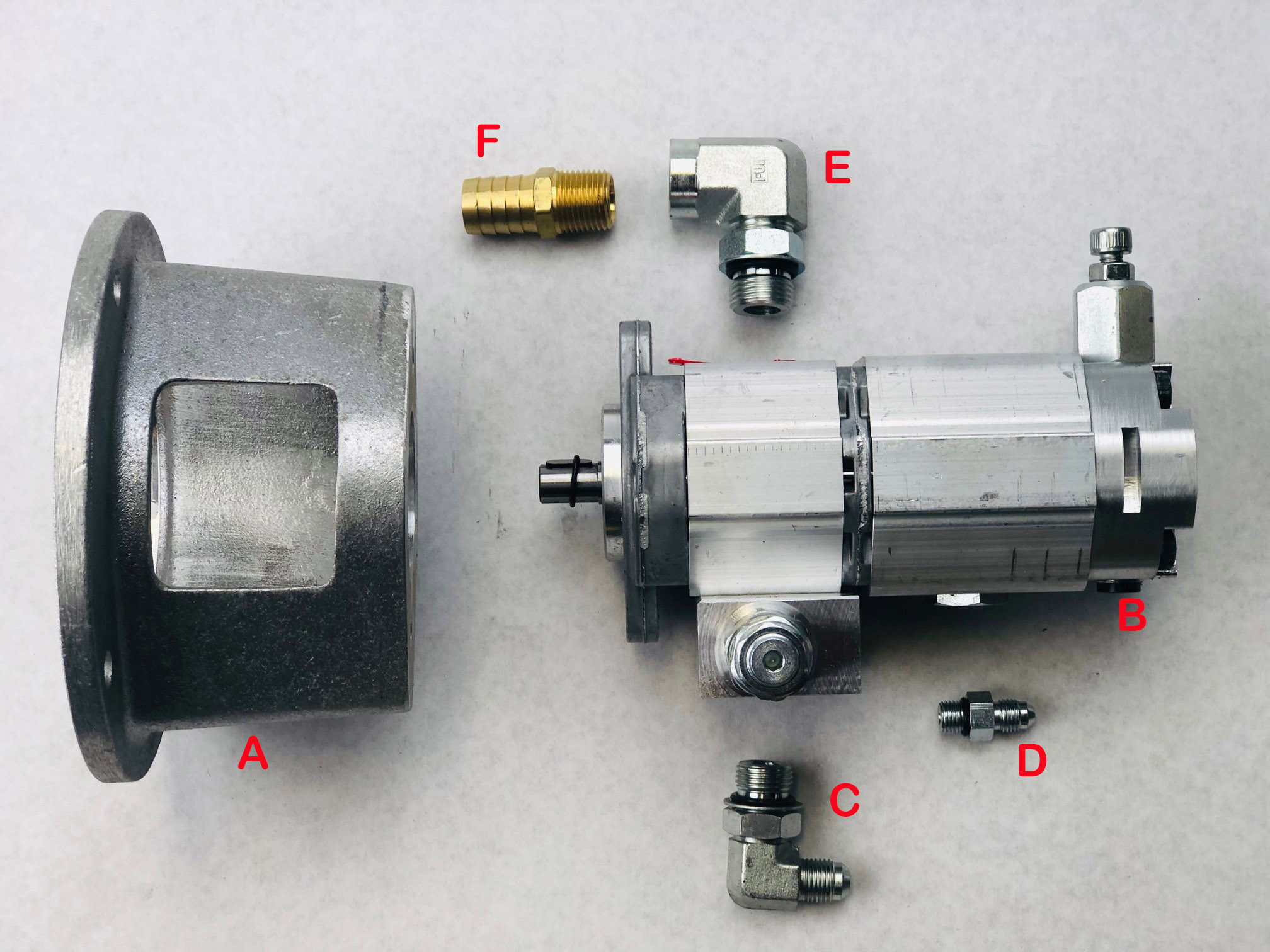 The components of a Ben Pearson motor and pump kit are shown in silver color with components labeled A-F.