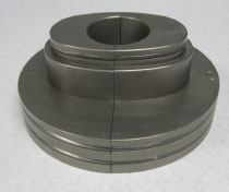 A cylindrical piece of custom tooling is made for Huth machinery.