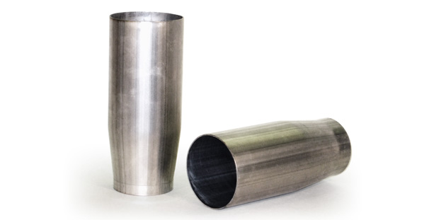 A photo shows two cylindrical exhaust cones made of stainless steel; one is horizontal, and one is vertical.