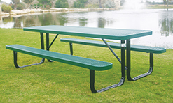 A green picnic table is sitting outdoors in a grassy field. The picnic table features bent tube legs as part of the frame and structure.