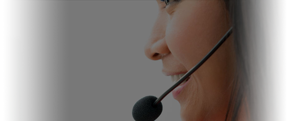 A pleasant-looking woman with dark hair wears a headset to field customer service calls for Huth-Ben Pearson International.